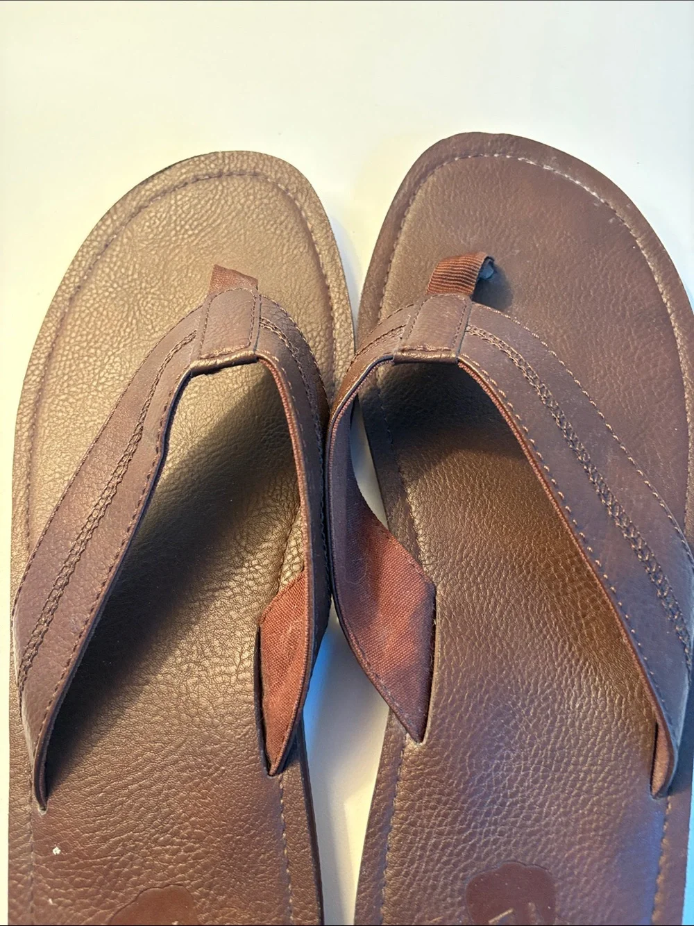 THREE pairs of men’s flip flops